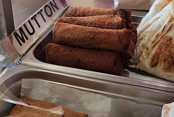 Mutton rolls and grilled wraps ready at the short eats counter